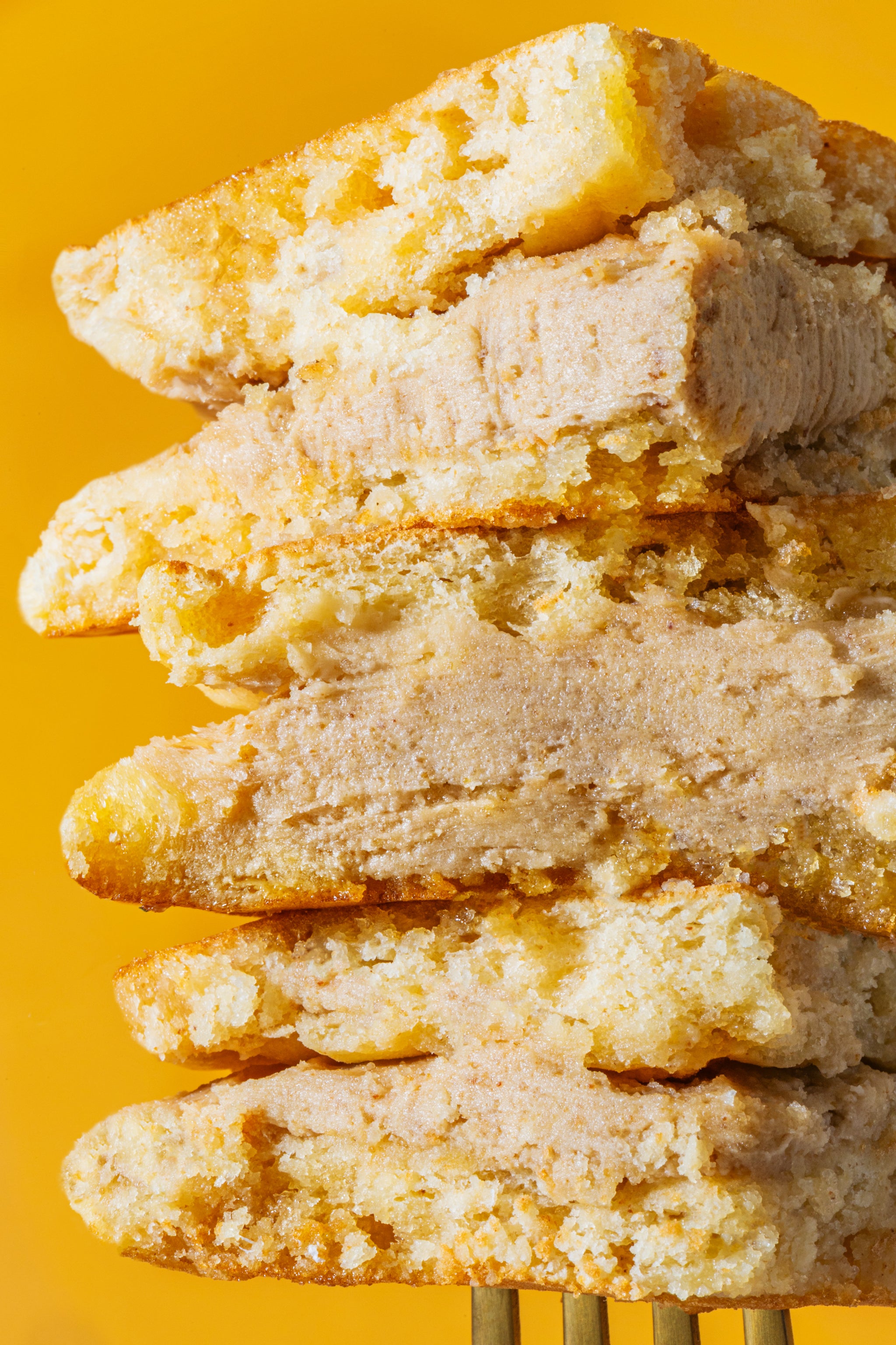 Classic Maple Pancake Sandwich cut and stacked on a fork.